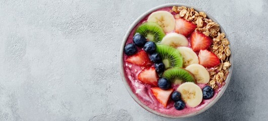 The Acai Bowl Topped With Fresh Strawberries, Bananas, Kiwis, Blueberries And Granola