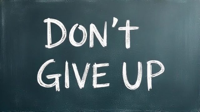 Inspirational message on a blackboard, encouraging someone to keep going