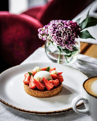 Enjoy a delicious Strawberry Tart adorned with lovely floral decorations