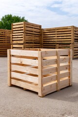 Large empty wooden crate stands on concrete surface with stacked crates in background