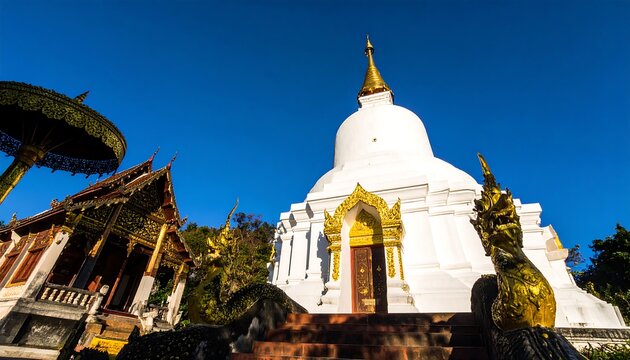 Buddhist temple complex under a clear sky - Powered by Adobe