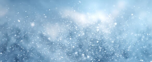 Obraz premium The Snowfall Over Soft Blue Bokeh Background With Falling Snowflakes And Light