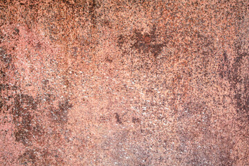 Weathered rusty metal surface with textured patterns and natural corrosion spots.