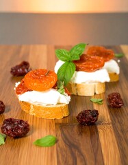 Bruschetta appetizer trio on a wooden board