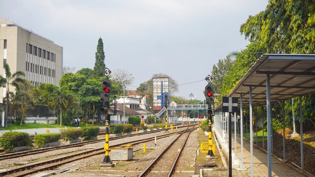 Multiple railway tracks at an urban train station in Indonesia