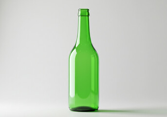 A single empty green glass bottle standing upright on a white surface in a studio setting image view