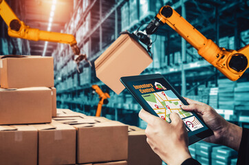 Smart robot arm systems for innovative warehouse and factory digital technology . Automation manufacturing robot controlled by industry engineering using IOT software connected to internet network .