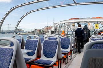 Interior of a Modern Boat With Comfortable Seating and Crew Preparing for a Journey Along the...