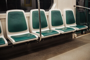Fototapeta premium Empty Subway Seats in a Modern Train During Off-Peak Hours in an Urban Area