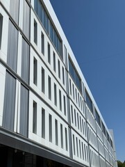 Modern White Building with Vertical and Horizontal Architectural Elements