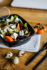 Healthy vegetable salad with tomatoes, peppers, cucumbers, onion and cheese.
