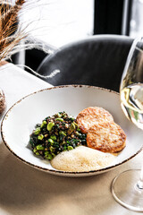 Experience an exquisite gourmet dish featuring fresh greens paired with