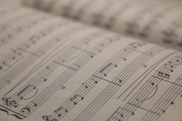 Obraz premium Sheets with musical notes as background, closeup