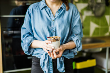 Healthy breakfast with yogurt, granola and chia seeds.