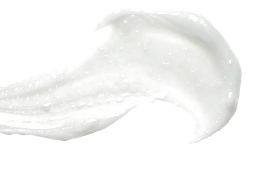 A close up of a white slightly translucent substance resembling toothpaste or lotion with a darker