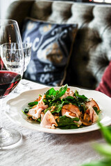 Try the Gourmet Salad with fresh Spinach and Salmon in
