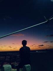 man sitting on the beach