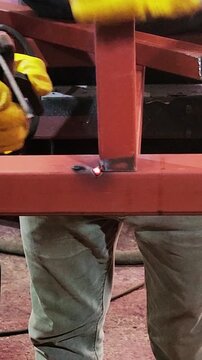 a welder who welds profile irons at ninety degrees