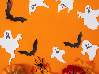 Halloween banner with pumpkins, ghosts, spiders, bats on an orange background, happy Halloween with space for text 