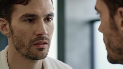 Close-up of two men, facial expression