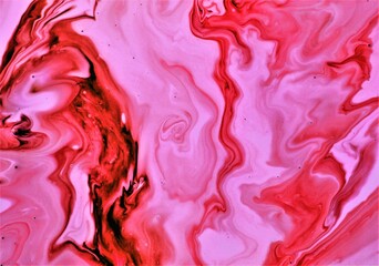 abstract background of red and pink paint in water, liquid marble