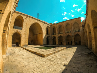 Kasimiyye Madrasa in Mardin, Turkey, featuring historic architecture, ancient stonework, and cultural heritage.