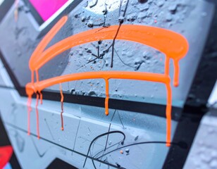 Detailed Abstract Graffiti Art With Vivid Orange Drips on Gray Textured Wall