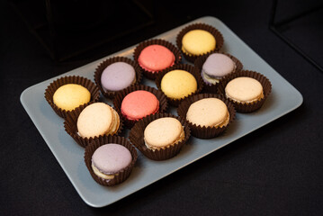 Assorted macarons on a plate display