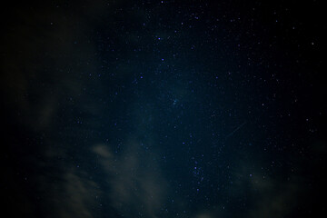 space background with stars and light clouds