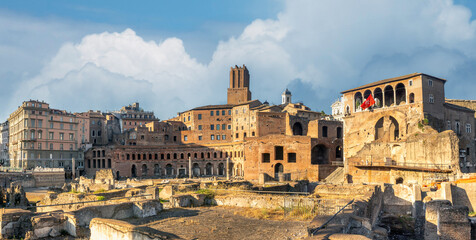 Obraz premium Recovered ruins of Trajan's market on the flanks of the Quirinal Hill below medieval structiures including the Castello delle Milizie, Via dei Fori Imperiali, Rome, Lazio, Italy