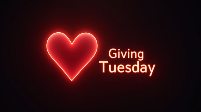 The words giving tuesday are illuminated in a warm glow next to a vibrant red heart, symbolizing the spirit of generosity, community support, and charitable giving on this global day dedicated to kind