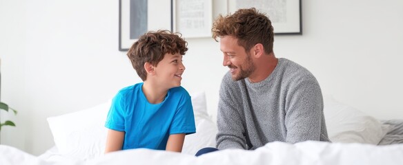 Obraz premium The father and son sharing a joyful moment together on a bright bedroom bed