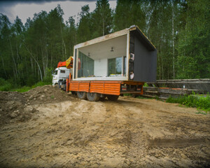 Obraz premium truck moving a modular house