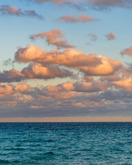 Romantic summer vacation at seascape. Sunset sea and seascape. Sea horizon view. Cloudy sky and seascape at summer vacation. Skyscape with sea horizon. Calm horizon with sea nature. Horizon at sunset