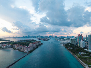 Fototapeta premium Miami Beach on blue sky. Skyline aerial view. Miami city. Tropical Miami scene. Miami district sky view. Famous oceanfront. Panoramic coastline.