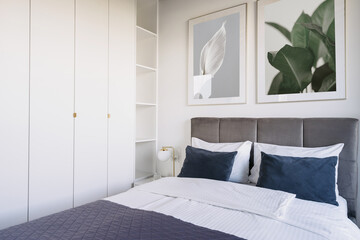 Modern hotel suite bedroom showcasing comfort and elegant design for a relaxing stay