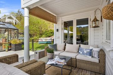 Exterior design of house, home and villa feature swimming pool, garden, terrace and decking, ocean seascape and beautiful sunset