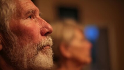 Medium shot of a retired wrestlers shadowed profile absorbing spouses careful health report timeline elements gently out of focus behind evoking quiet anticipation before a