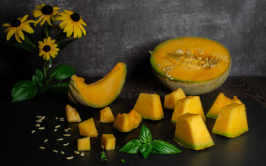 Melon pieces and slices on a table