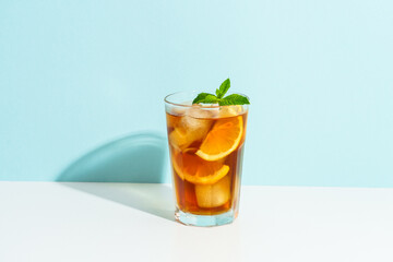 Summer cold drink on colored background with hard shadows.