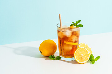 Summer cold drink on colored background with hard shadows.