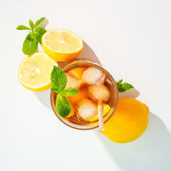 Summer cold drink on colored background with hard shadows.