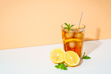 Summer cold drink on colored background with hard shadows.