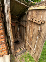 old vintage village toilet outside.