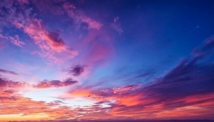Obraz premium dramatic sunset sky with vibrant purple pink orange and blue clouds creating a peaceful and awe inspiring atmosphere