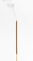 ultra realistic close up front view of a single brown incense stick with wooden stick visible at bottom lit with soft smoke isolated on pure white background