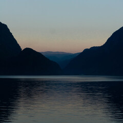Sunset over the lake and mountains
