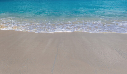 Grace Bay Turks and Caicos. Caribbean Tranquil Turquoise Waves Gently Washing Onto Sandy Shore