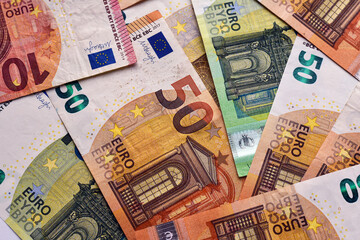 Finance concept. Many european euro money. Pile euro banknotes with different colors and condition close up. Economic growth. A lot of bills.