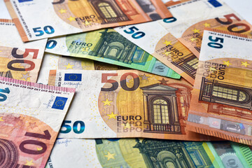 Finance concept. Many european euro money. Pile euro banknotes with different colors and condition close up. Economic growth. A lot of bills.